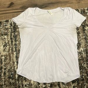 Size 6 Lulu lemon athletic short sleeve shirt with cute scoop detail on bottom